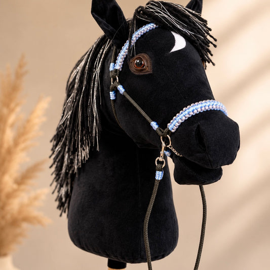 Black hobby horse with silver-threaded mane and light blue bridle, handmade stick horse with personalized pendant.