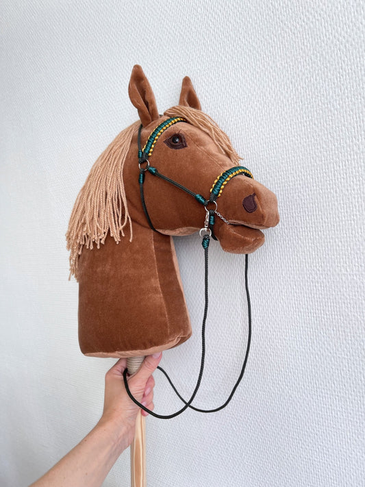Handmade caramel hobby horse with bridle, reins, and personalized tassel charm