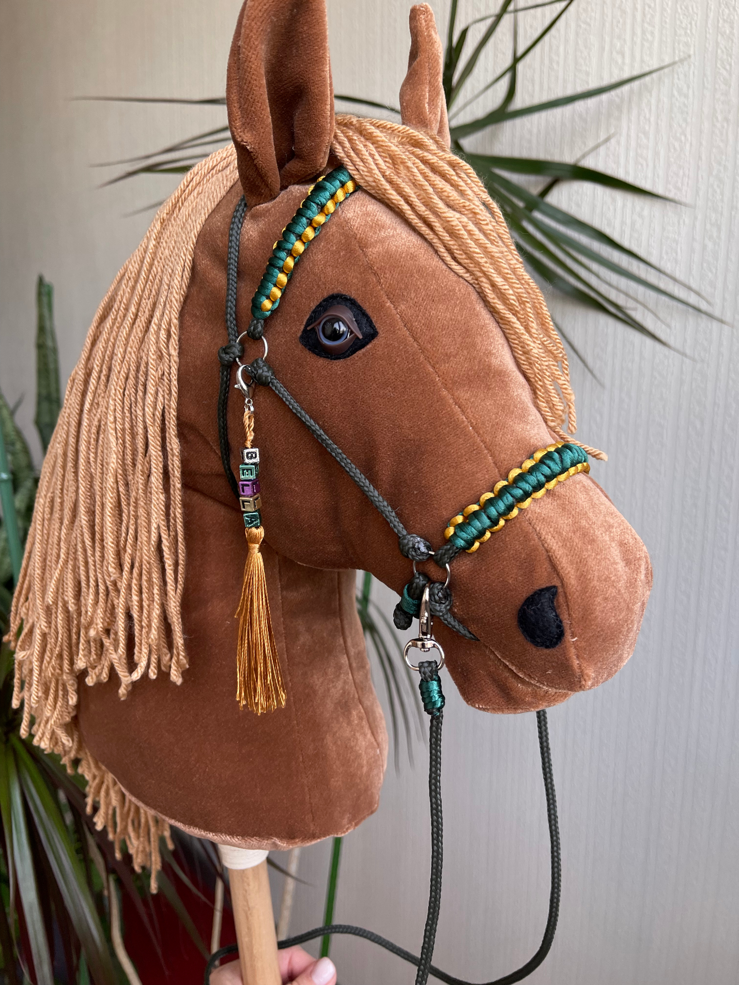 Light brown hobby horse with caramel yarn mane and name tag accessory