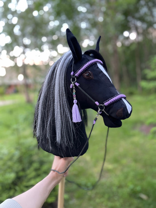 Handmade black stick horse with violet bridle and personalized name tag
