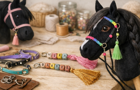 Handmade hobby horses with colorful beaded bridles, personalized name tags, and tassel accessories displayed in a cozy workshop setting