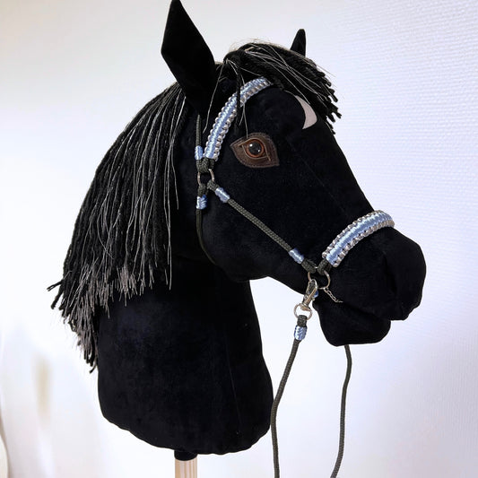 Black hobby horse Silvermoon with silver-thread mane, white crescent marking, and blue-silver bridle – handmade stick horse.