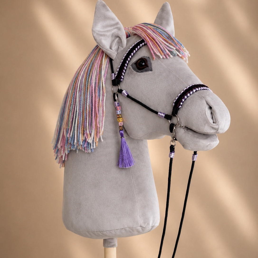 Light grey hobby horse with rainbow yarn mane and handcrafted bridle – handmade stick horse
