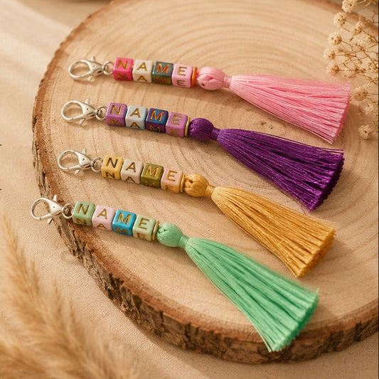 Personalized hobby horse name tags with tassels in various colors, custom engraved name charms for handmade hobby horses, unique accessories designed to add a personal touch to every hobby horse collection
