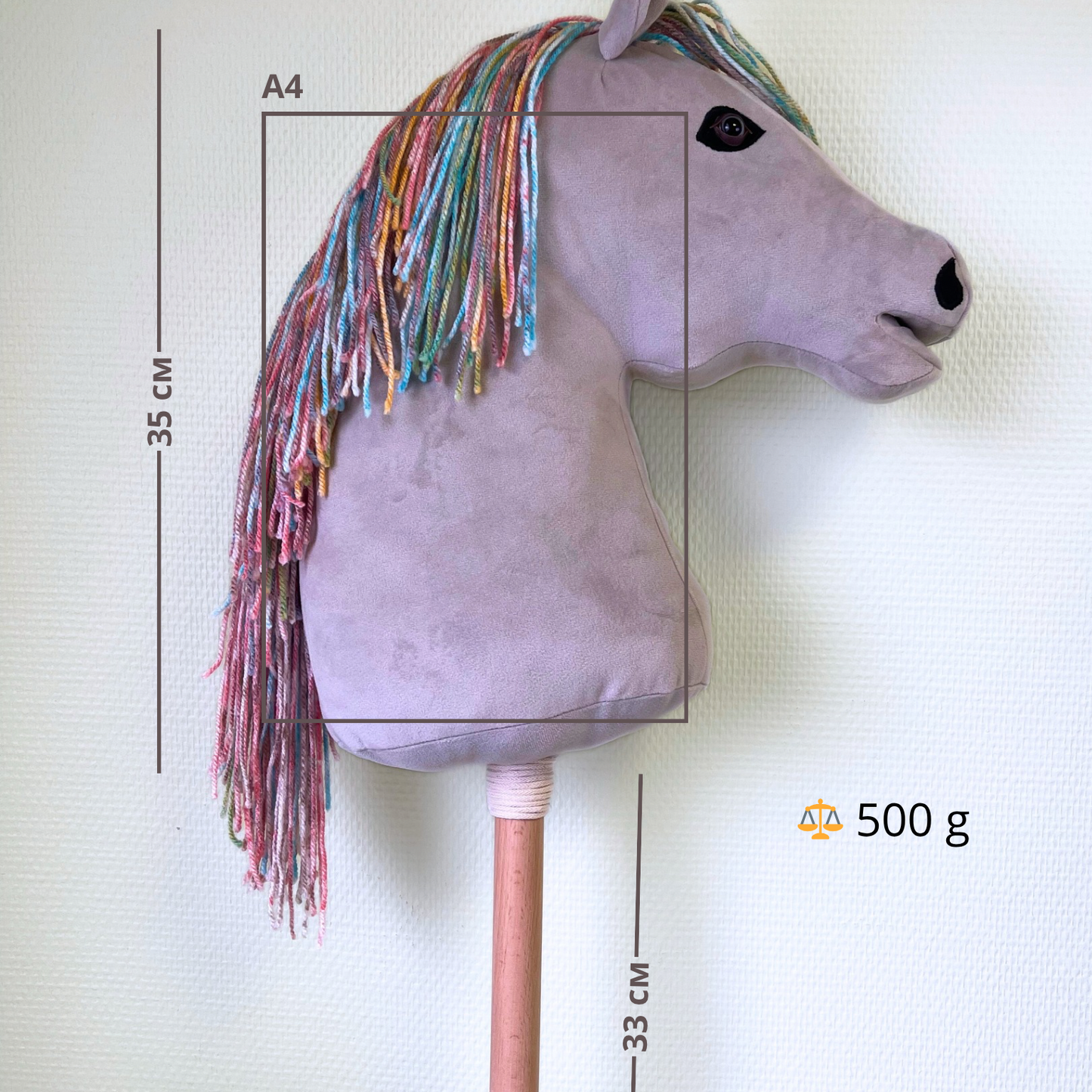 Light grey handmade hobby horse with a colorful rainbow mane, featuring an infographic with hobby horse dimensions and weight details, premium stick horse design for kids and hobby horsing enthusiasts