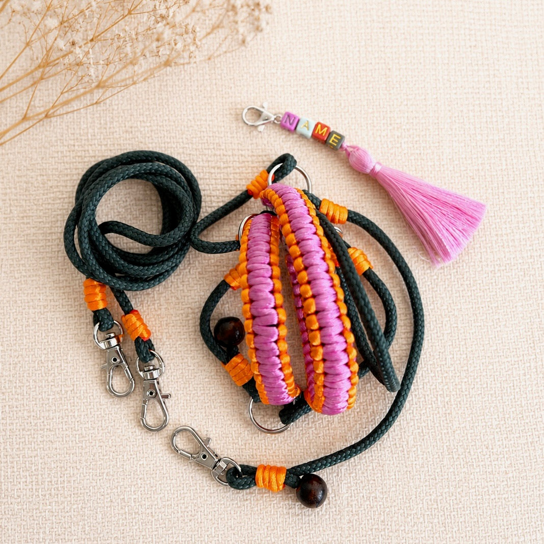 Handmade hobby horse bridle set with reins and personalized tassel name tag in pink and orange colors