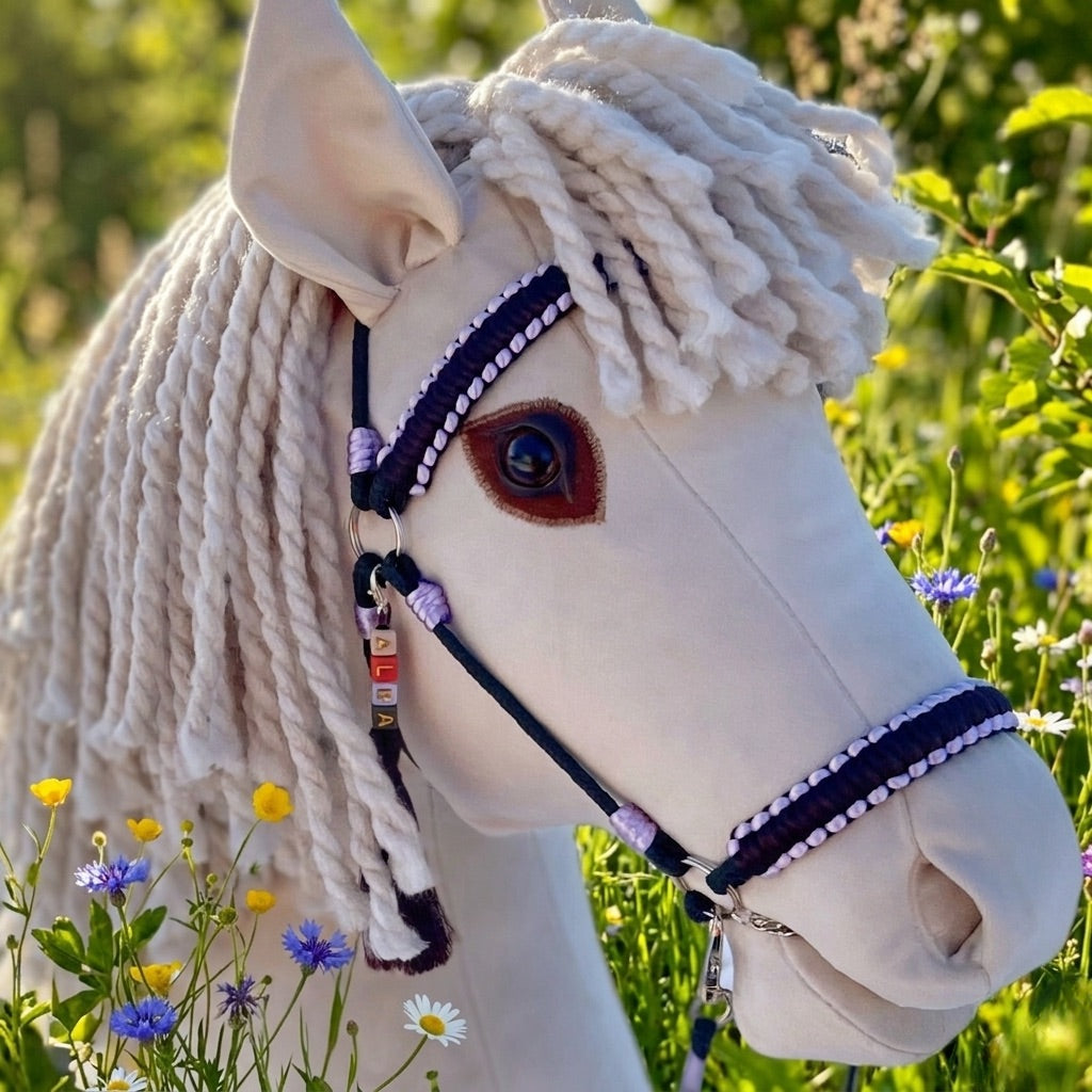 Close-up of hobby horse wearing lavender handmade bridle and reins with personalized tassel tag